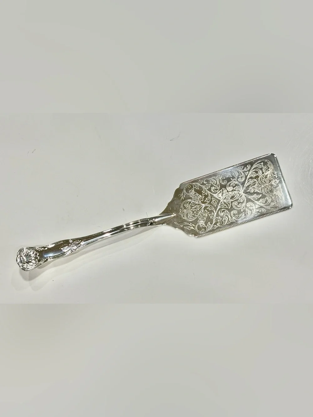Vintage Polished Silver-Plated Server with Ornate Engraved Details